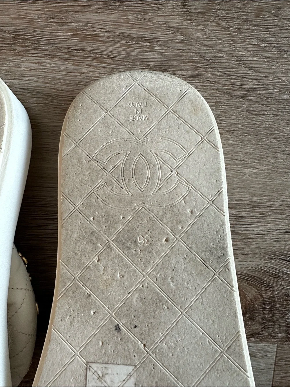 CHANEL 23S White Quilted Logo Flip Flops with Gold Charms
